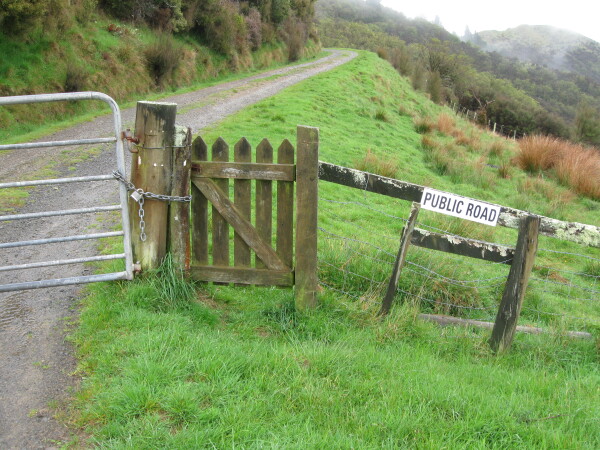 Gate and fence with Public Road sign on Hinerua Rd taken in 2011