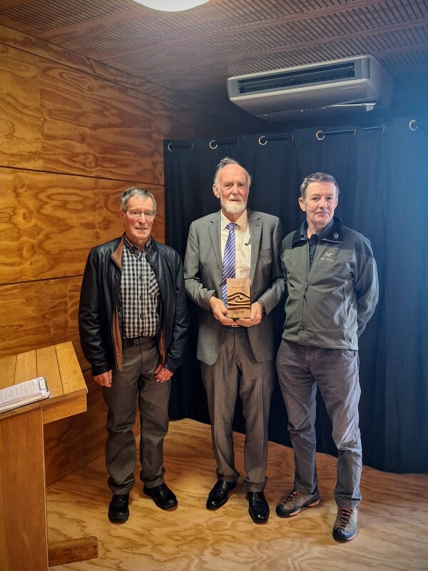 Arthur Blondell recieves award from Hugh Logan