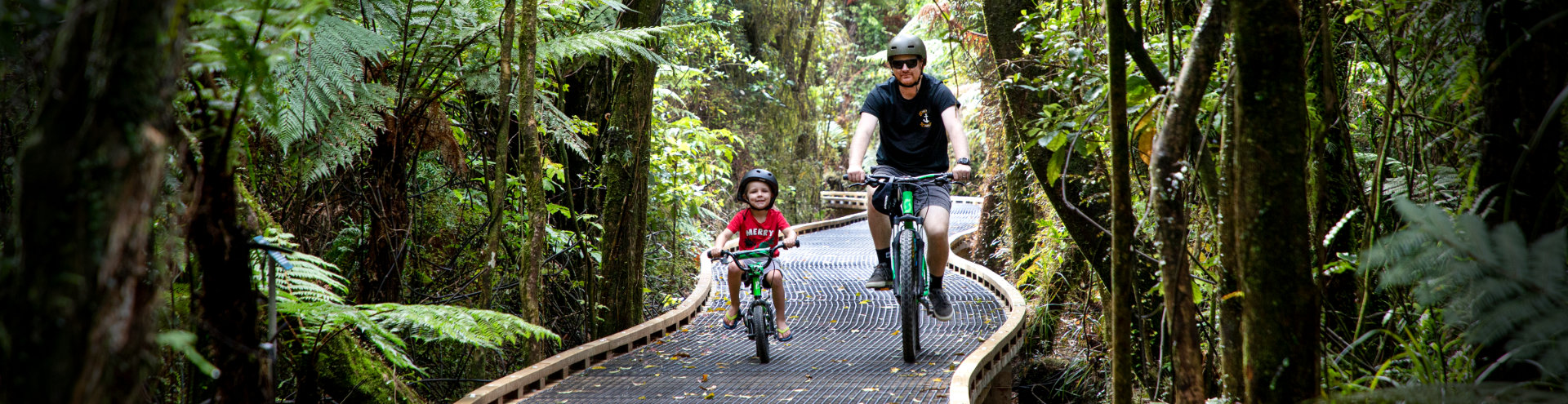 Bikers on Kawatiri Coastal Trail boardwalk