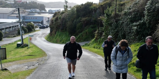 Commission staff walking up quite street in Bluff