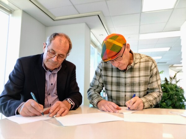 Don Cameron (Chair of the Outdoor Access Commission Board) and John Birch (Chair of Te Araroa Trust) sign a new Memorandum of Understanding and Agreement to Grant