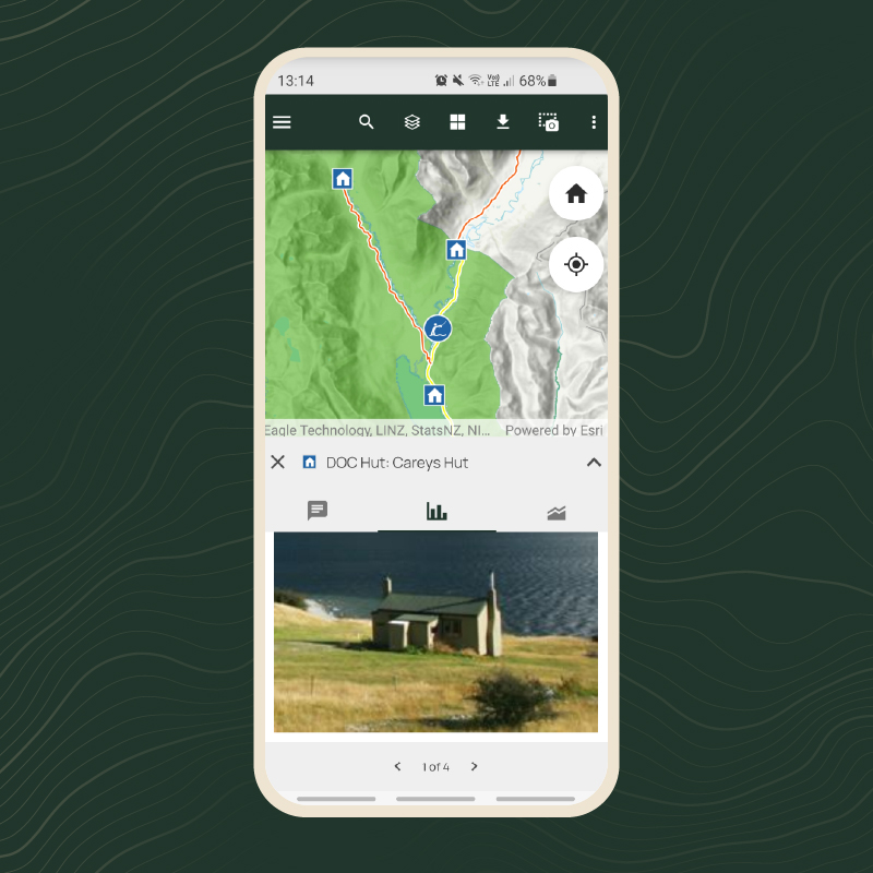 Phone showing map and DOC hut photo