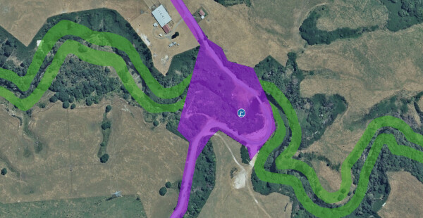 A satellite view of a river with access highlighted and an angling icon